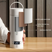 Thermos bottle with digital display held by a person, labeled with features on a wooden surface.